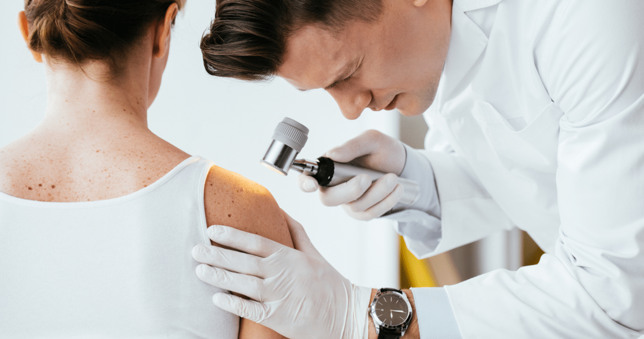 dermatologist examining patient